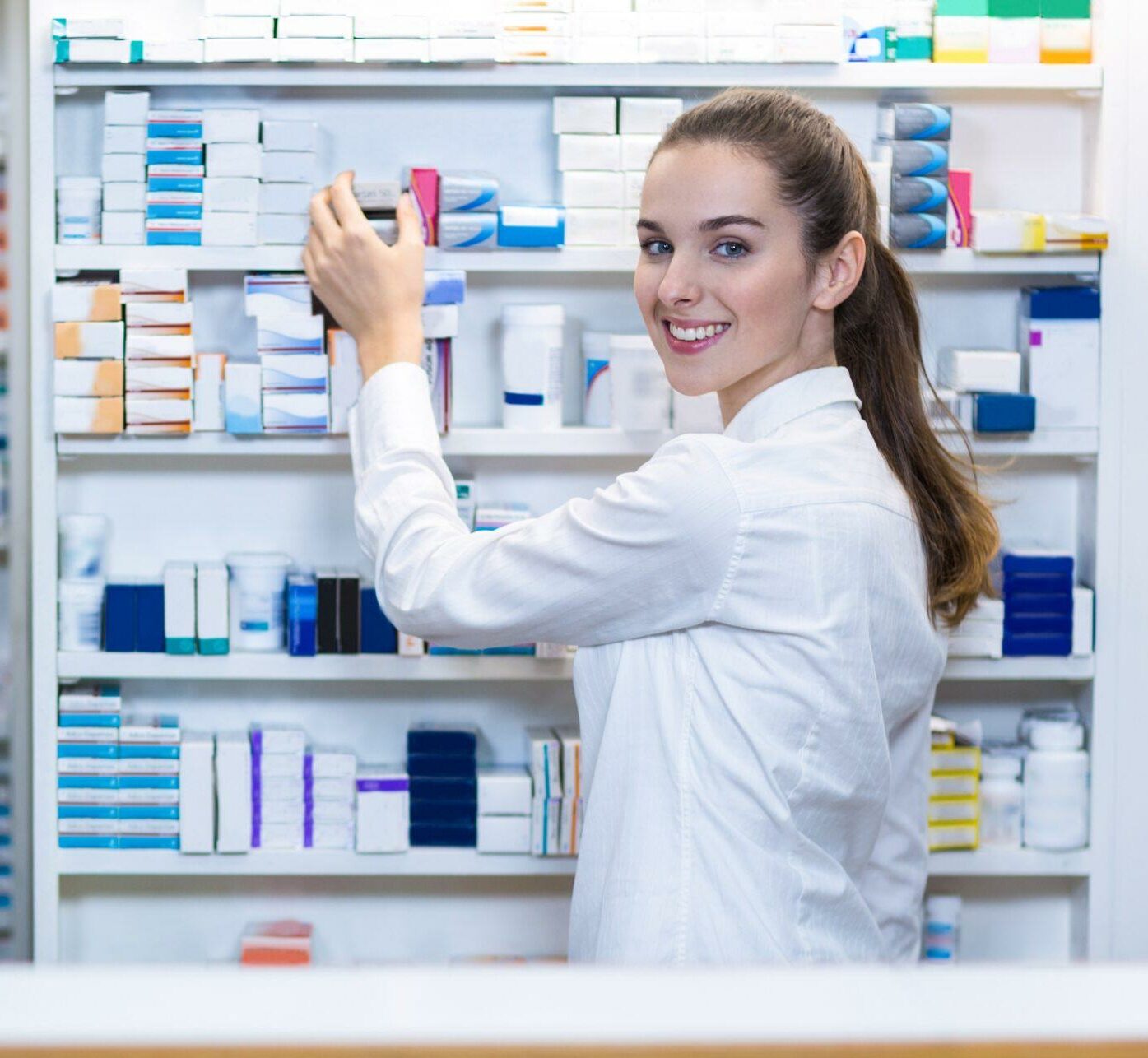 Pharmacist checking a medicine in pharmacy